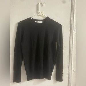 Women’s black sweater with gold buttons. Very lightly used. Good condition.